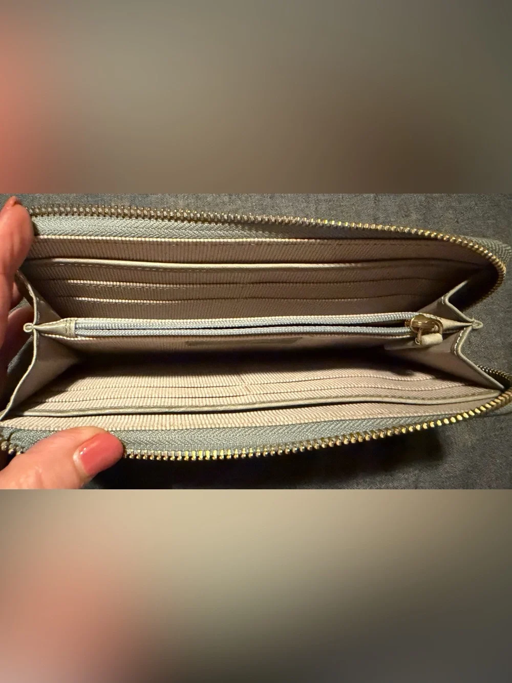 Margot “Gabby” zip around wallet in grey/beige with light blue accents.